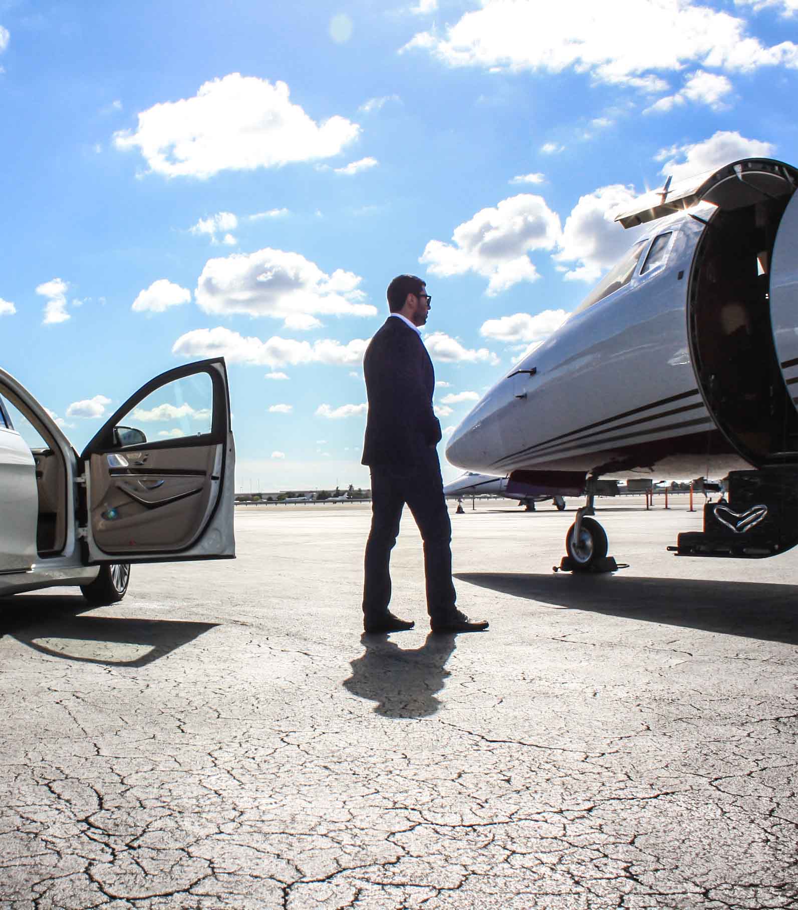 a businessman going toward private jet